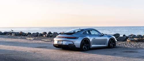 A high-performance Porsche GT3 RS sports car featuring aerodynamic styling. UWUHD wallpaper for laptop download