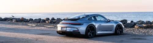 A high-performance Porsche GT3 RS sports car featuring aerodynamic styling. Dual UHD wallpaper images