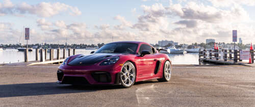 A close-up view of a high-performance Porsche sports car showcasing its luxurious... UWUHD wallpaper