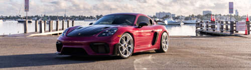 A close-up view of a high-performance Porsche sports car showcasing its luxurious... Dual UHD wallpaper for laptop download