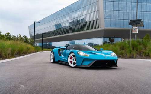 A high-performance Ford GT supercar featuring its signature aerodynamic body and... 7680x4800 free desktop wallpaper