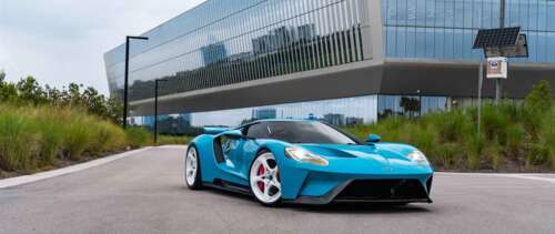 A high-performance Ford GT supercar featuring its signature aerodynamic body and... UWUHD ps4 wallpaper