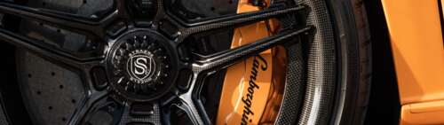 A high-performance Lamborghini Aventador SVJ supercar in a dynamic setting. Dual UHD free wallpaper