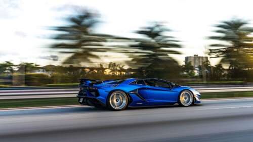 A close-up view of a Lamborghini Aventador SVJ showcasing its aggressive aerodynamic... 4K (Ultra HD) wallpaper download