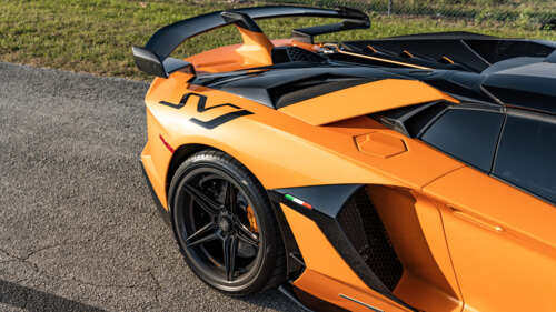 A high-performance Lamborghini Aventador SVJ supercar displaying aggressive aerodynamic... 4K (Ultra HD) wallpaper images