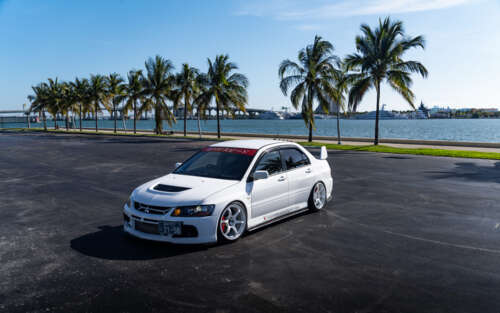 High-performance Mitsubishi Lancer Evolution IX sports sedan in a striking pose 7680x4800 background images hd