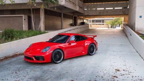 A detailed view of a Porsche 992 GTS sports car highlighting its aerodynamic body... 4K (Ultra HD) wallpaper images