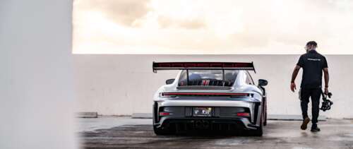 A detailed view of a sleek, high-performance Porsche GT3 RS sports car. UWUHD free wallpaper for computer