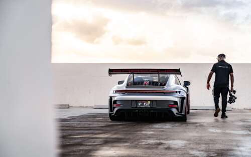 A detailed view of a sleek, high-performance Porsche GT3 RS sports car. 7680x4800 free hd wallpapers