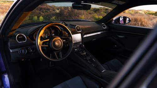 A sleek and powerful Porsche GT3 RS sports car showcasing its aerodynamic design. 8K wallpaper images