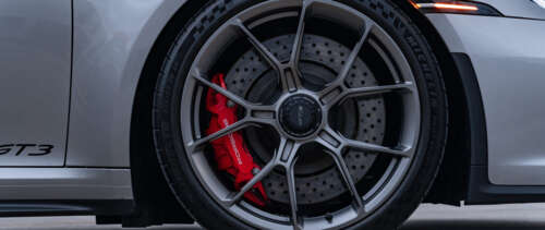 A high-performance Porsche GT3 RS sports car featuring aerodynamic bodywork and a... UWUHD free wallpaper
