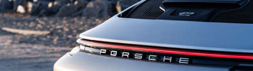 A high-performance Porsche GT3 RS sports car featuring aggressive aerodynamic styling... Dual UHD ps4 wallpaper
