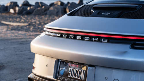 A high-performance Porsche GT3 RS sports car featuring aggressive aerodynamic styling... 4K (Ultra HD) ps4 wallpaper