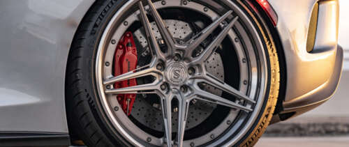 A high-performance McLaren supercar featuring sleek aerodynamic lines and a modern... UWUHD free hd wallpapers