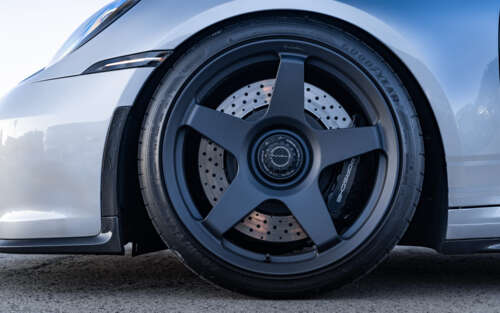 A detailed shot of a high-performance Porsche GT3 RS sports car. 7680x4800 ps4 wallpaper