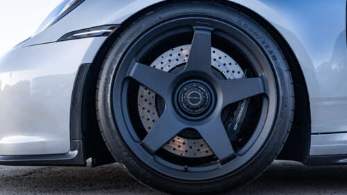 A detailed shot of a high-performance Porsche GT3 RS sports car. 8K wallpaper download