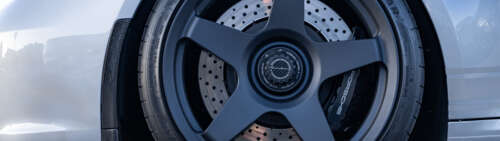 A detailed shot of a high-performance Porsche GT3 RS sports car. Dual UHD wallpaper download