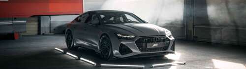 A high-performance Audi RS7 luxury sports car featuring a sleek, aerodynamic design... Dual UHD wallpaper for laptop download