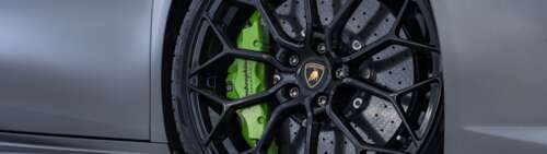 A high-performance Lamborghini Huracan sports car in a sharp, detailed view. Dual UHD free background images