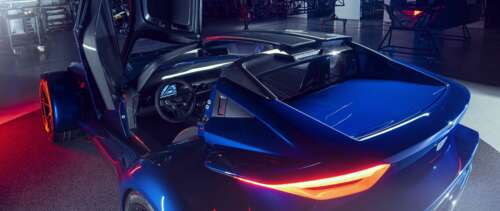 A sleek, metallic silver sports car reflecting soft studio lights against a dark... UWUHD high definition wallpaper