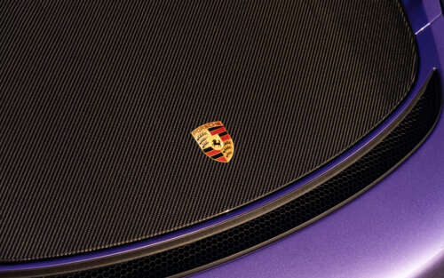 A high-performance Porsche GT3 RS sports car showcasing its aerodynamic features... 7680x4800 free wallpaper