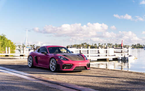 A luxury Porsche sports car parked on a modern urban street during twilight. 7680x4800 hd background