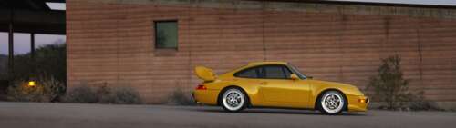A high-quality, detailed view of a sleek and modern Porsche sports car. Dual UHD high definition wallpaper