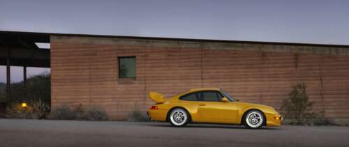 A high-quality, detailed view of a sleek and modern Porsche sports car. UWUHD hd background