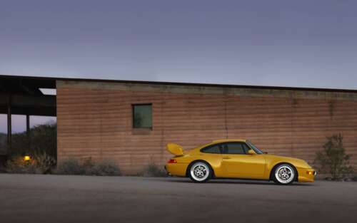 A high-quality, detailed view of a sleek and modern Porsche sports car. 7680x4800 wallpaper for pc download