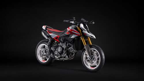 A high-resolution studio shot of the 2026 Ducati Hypermotard V2 motorcycle against... wallpaper