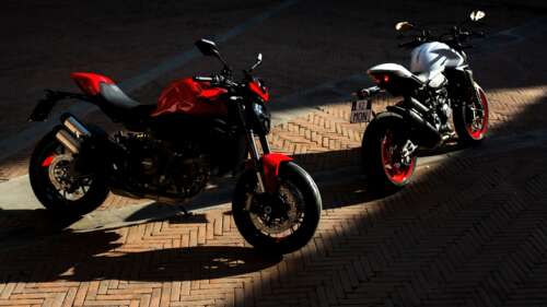 A futuristic and sleek 2026 Ducati Monster V2 sports motorcycle in high resolution. free background