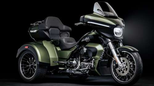 A cinematic, high-detail shot of a Harley-Davidson Street Glide cruiser motorcycle... free wallpaper for computer