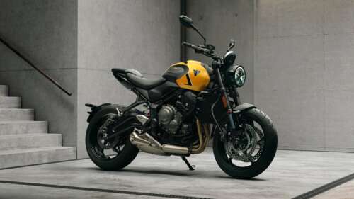 A high-detail shot of the 2026 Triumph Trident 660 naked motorcycle, showcasing its... wallpaper photo gallery download