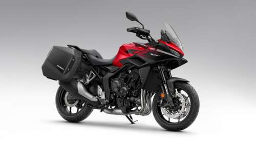 A sleek and aerodynamic 2026 Honda CB1000GT sports motorcycle in high-definition... wallpaper for laptop download