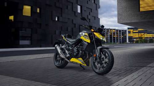 A modern 2026 Honda CB750 Hornet motorcycle parked outdoors, showcasing futuristic...