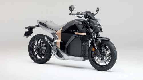 The futuristic Honda WN7 electric motorcycle concept on display at the EICMA Motorcycle... hd background
