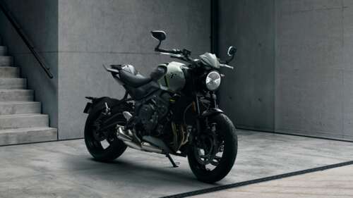 A detailed, high-resolution view of a muscular black Triumph Trident 660 street motorcycle. pictures for wallpaper