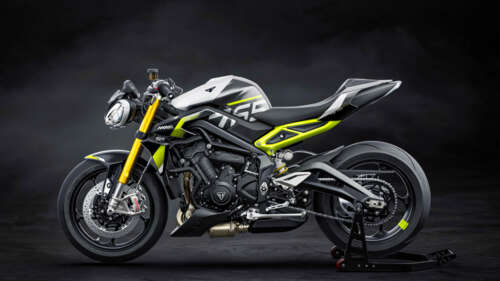 A high-performance 2026 Triumph Street Triple 765 Moto2 Edition motorcycle displayed... wallpaper download