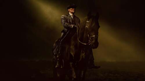 A dark and cinematic close-up of Tommy Shelby, played by Cillian Murphy, from Peaky...