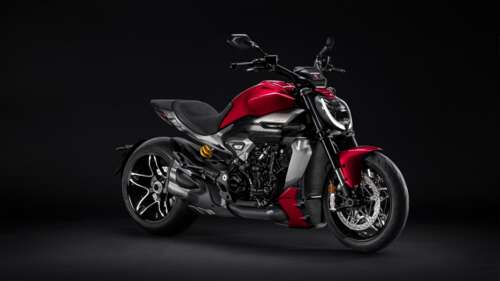 A high-resolution, close-up view of a 2025 Ducati XDiavel V4 motorcycle featuring... wallpaper