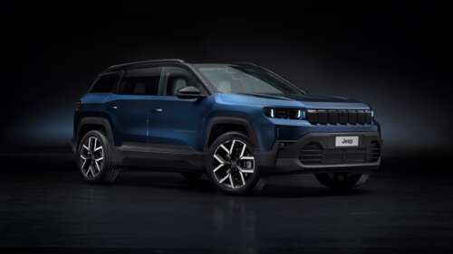 A sleek and modern 2025 Jeep Compass e electric SUV presented in a dark, cinematic... free background images