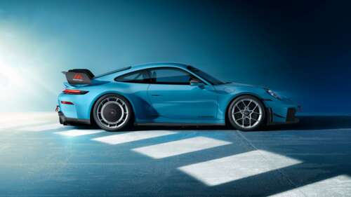 A high-resolution close-up of a blue Porsche 911 GT3 with a cool blue aesthetic and... free wallpaper
