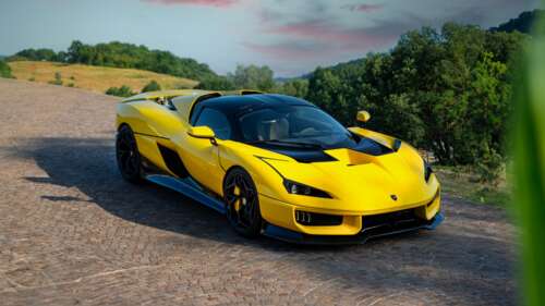 A sleek and futuristic 2026 hypercar with aerodynamic curves and advanced lighting... wallpaper