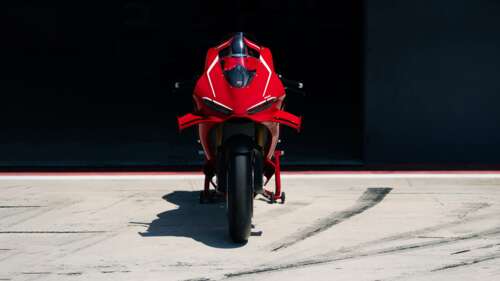 A sleek and powerful red 2026 Ducati Panigale V4 R sports motorcycle. desktop wallpaper