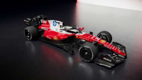 Futuristic 2026 Formula One racing cars captured in extreme detail on a professional... wallpaper