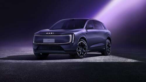 A sleek, futuristic electric SUV in a vibrant purple color with neon lighting accents... free hd wallpapers
