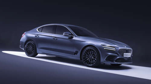 A high-end, futuristic 2026 Genesis G70 luxury sedan featuring modern LED lighting... wallpaper