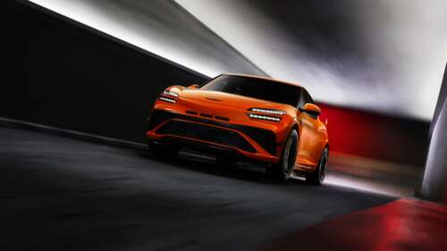 A cinematic, high-resolution shot of the 2026 Genesis GV60 Magma performance electric... free background