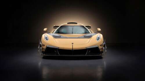 A dramatic, high-resolution shot of a modified 2026 Mansory Koenigsegg Jesko sports... free wallpaper
