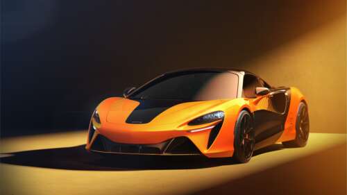 A vibrant orange 2026 McLaren Artura Spider Championship Edition sports car featuring... free wallpaper